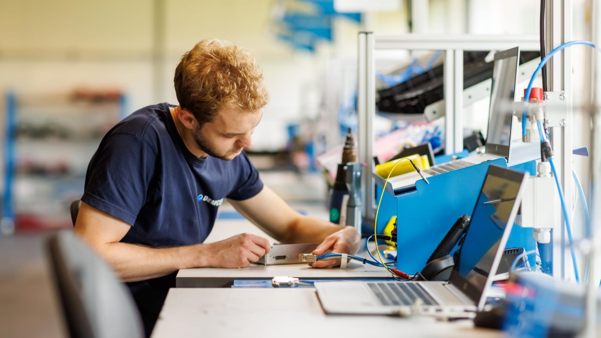 male_technician_manufacturing_module_cables