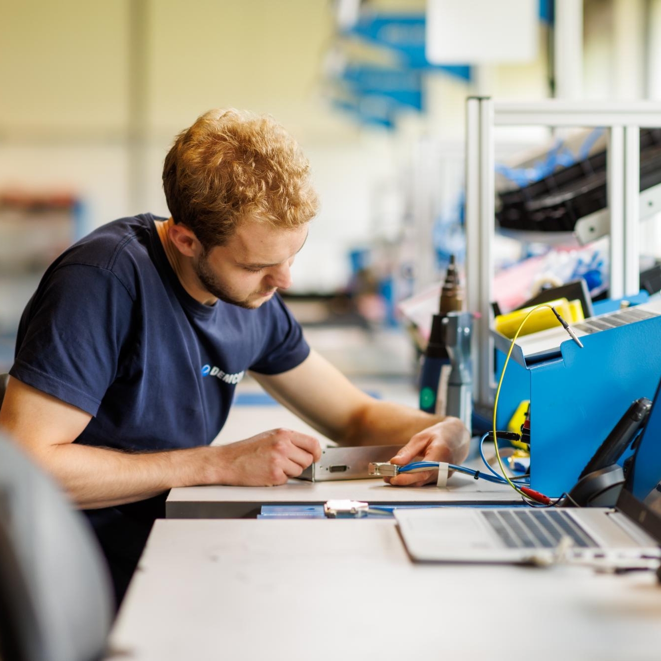 male_technician_manufacturing_module_cables