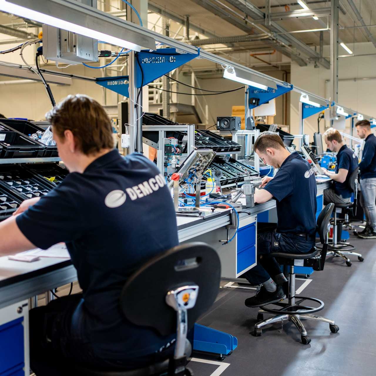 male_technicians_production_line_overview