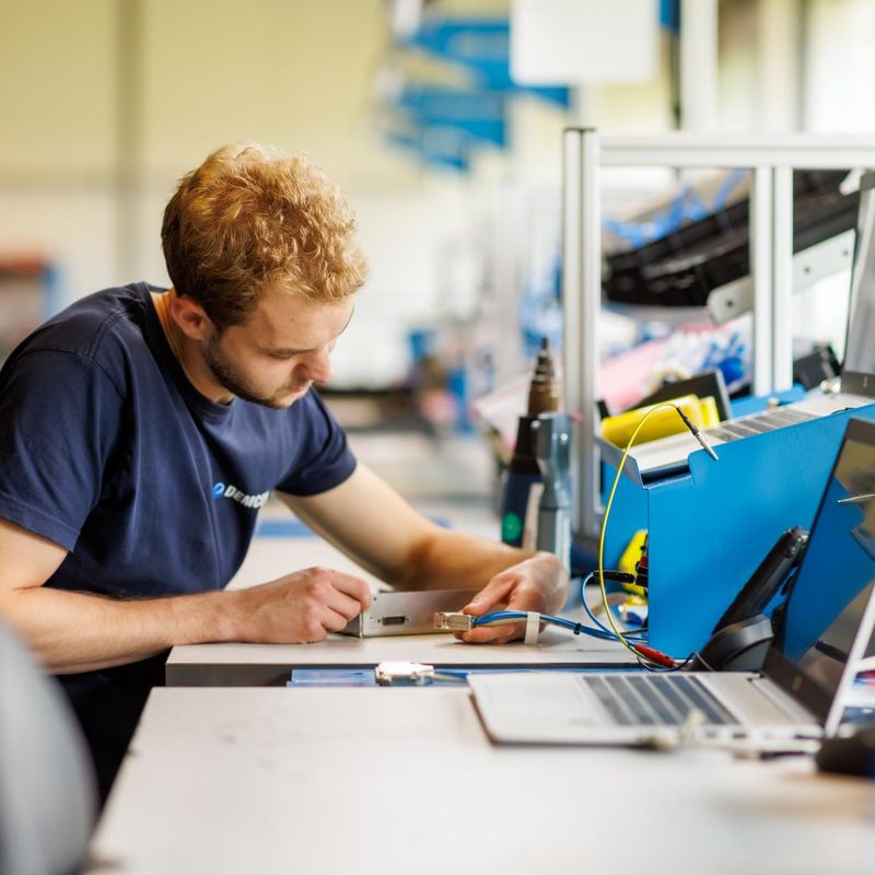 male_technician_manufacturing_module_cables