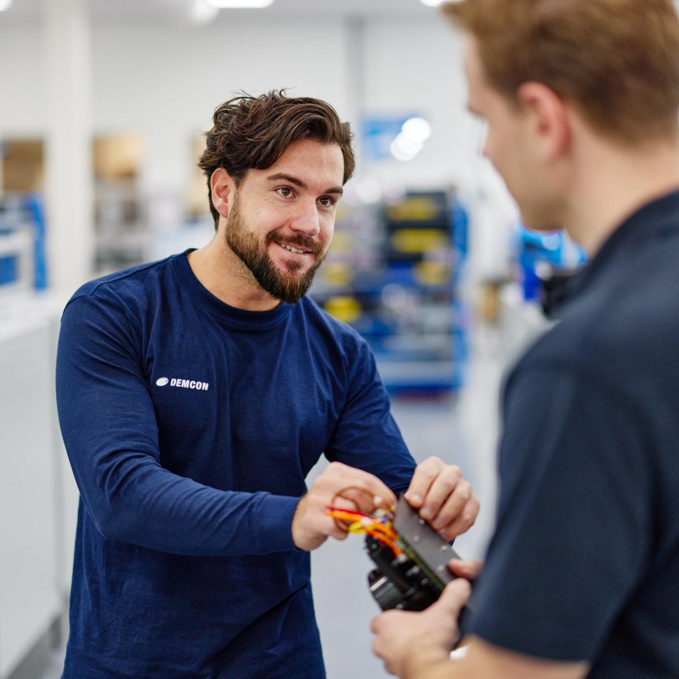 male_colleagues_hand_over_module